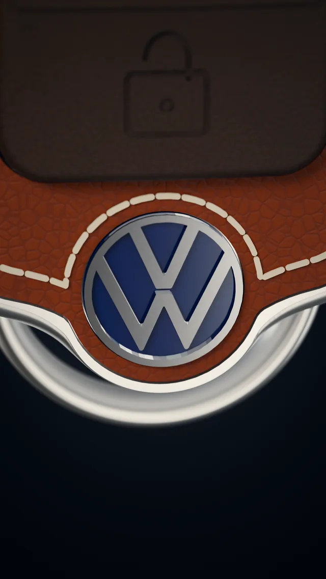 The rounded end of the key, edged in aluminium, with the stitching arching round it